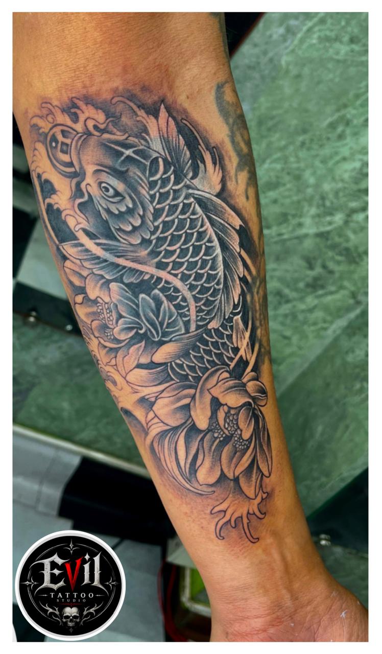 Koi Fish Style Forearm Tattoo